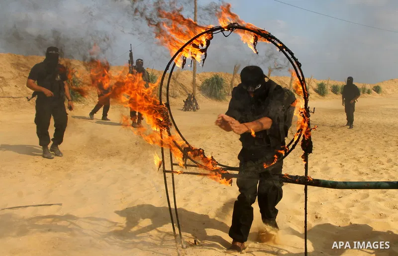 Palestinian militants from Al-Ansar brigades, the armed wing of Al-Ahrar movement, demonstrate their skills during a drill in front of the media in Khan Younis in the southern Gaza Strip July 7, 2011. Photo by Ashraf Amr...