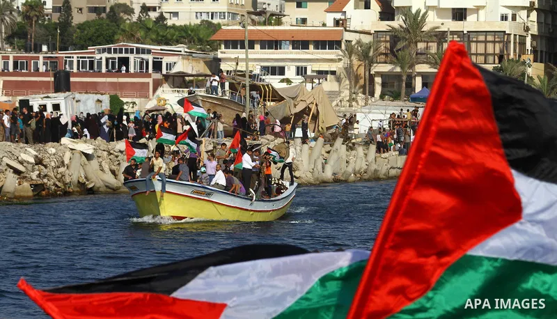 Palestinians take Part during a protest in the port at Gaza City on July 7, 2011. Pro-Palestinian activists hoping to sail to Gaza this week fully expected their flotilla to be blocked by Israeli marines. Photo by Ashraf...