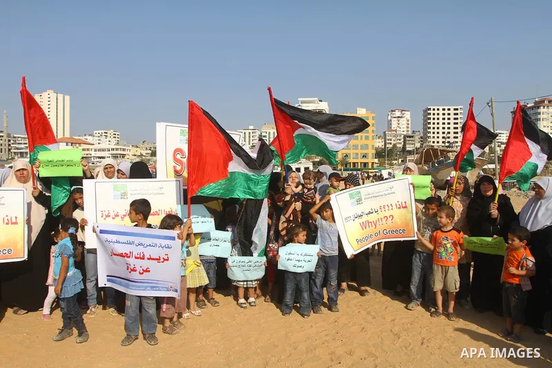 Palestinians take Part during a protest in the port at Gaza City on July 7, 2011. Pro-Palestinian activists hoping to sail to Gaza this week fully expected their flotilla to be blocked by Israeli marines. Photo by Ashraf...
