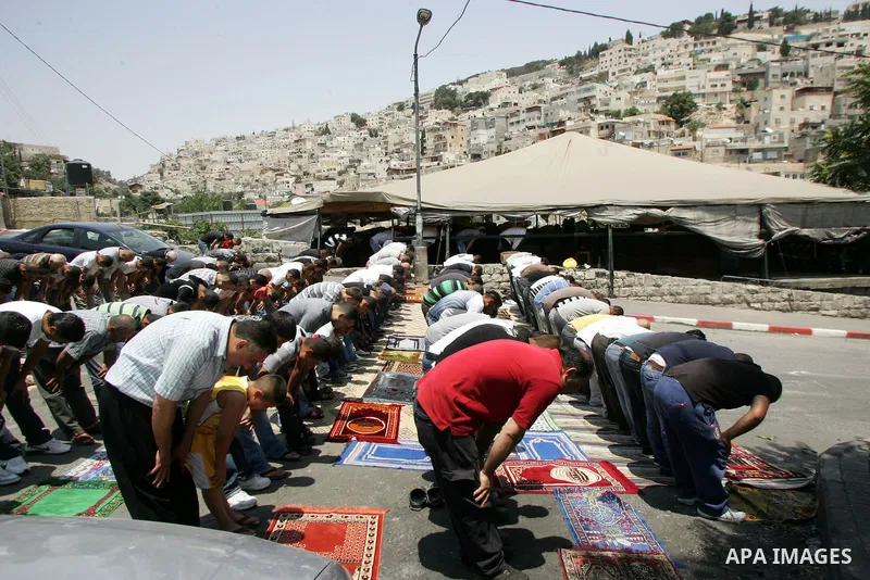 Palestinians attend Friday prayers at the protest tent in the Silwan neighborhood in East Jerusalem on July 8,2011 as Palestinian protesters gather for a demonstration. Photo by Mahfouz Abu Turk