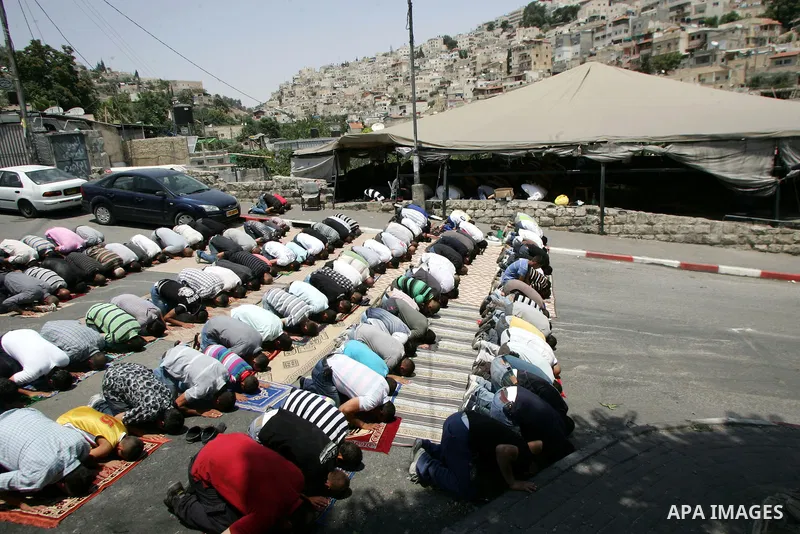 Palestinians attend Friday prayers at the protest tent in the Silwan neighborhood in East Jerusalem on July 8,2011 as Palestinian protesters gather for a demonstration. Photo by Mahfouz Abu Turk