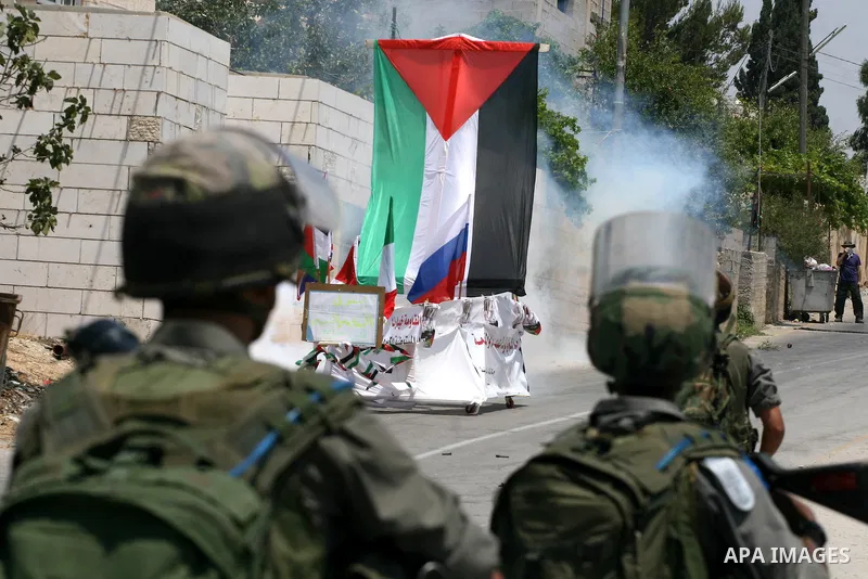 Israeli soldiers clash with Palestinian protesters from the West Bank village of Nabi Saleh, north of Ramallah, on July 8, 2011, during the weekly Friday protest against Israeli West Bank settlement expansion. Photo by I...