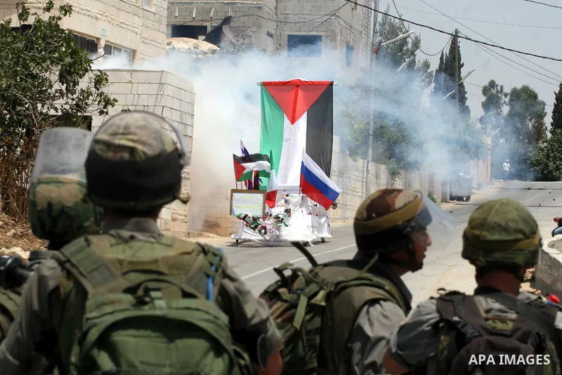 Israeli soldiers clash with Palestinian protesters from the West Bank village of Nabi Saleh, north of Ramallah, on July 8, 2011, during the weekly Friday protest against Israeli West Bank settlement expansion. Photo by I...