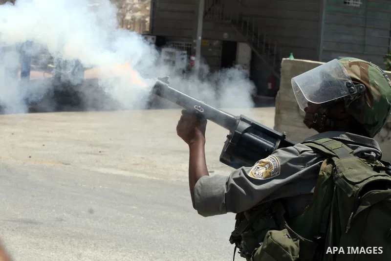 Israeli soldiers clash with Palestinian protesters from the West Bank village of Nabi Saleh, north of Ramallah, on July 8, 2011, during the weekly Friday protest against Israeli West Bank settlement expansion. Photo by I...