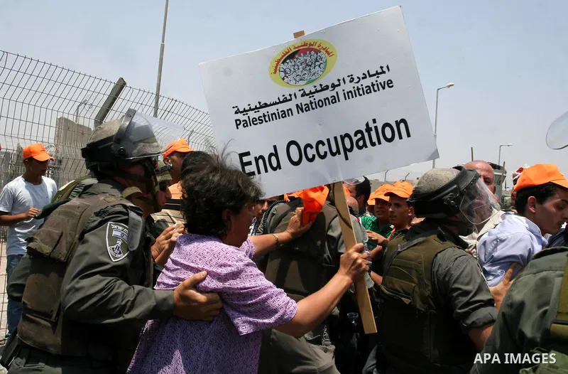 Israeli security forces push back locally-based Palestinian demonstrators during clashes at the Qalandia checkpoint between the West Bank city of Ramallah and Jerusalem, Saturday, July 9, 2011. Israel's interior ministry...