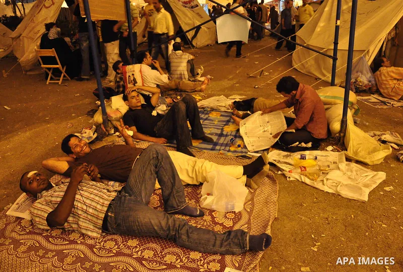 Hundreds of demonstrators gather as they spend their second night in Cairo's Tahrir Square, on July 10, 2011, at the landmark square vowing to keep up their sit-in despite a series of concessions by the Egyptian prime mi...