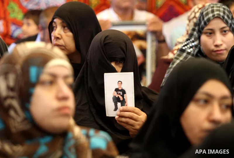 Relatives of Palestinian prisoners attend a march organized by the Red Cross calling Israel to allow residents of Gaza to visit their relatives imprisoned in Israel, on July 11, 2011 in Gaza City. Israel stopped allowing...