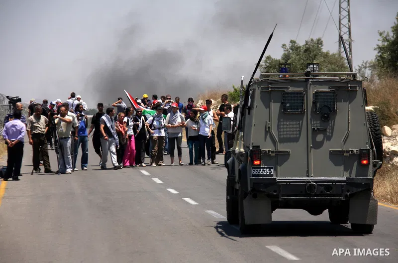 Palestinian and foreign protesters demonstrate against Israeli occupation and settlements on July 11, 2011in the village of Ezbet Tabeeb near the West Bank town of Qalqilya. Photo by Wagdi Eshtayah