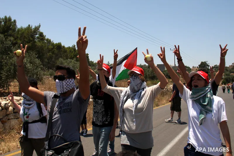 Palestinian and foreign protesters demonstrate against Israeli occupation and settlements on July 11, 2011in the village of Ezbet Tabeeb near the West Bank town of Qalqilya. Photo by Wagdi Eshtayah