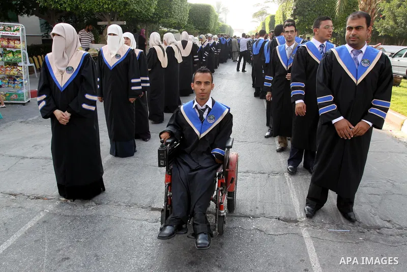 Palestinian students participate in their graduation ceremony at the Islamic University in Gaza city on July 12, 2011. Photo by Mohammed Asad