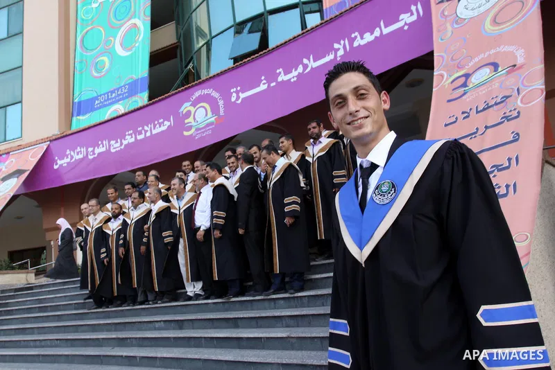 Palestinian students participate in their graduation ceremony at the Islamic University in Gaza city on July 12, 2011. Photo by Mohammed Asad