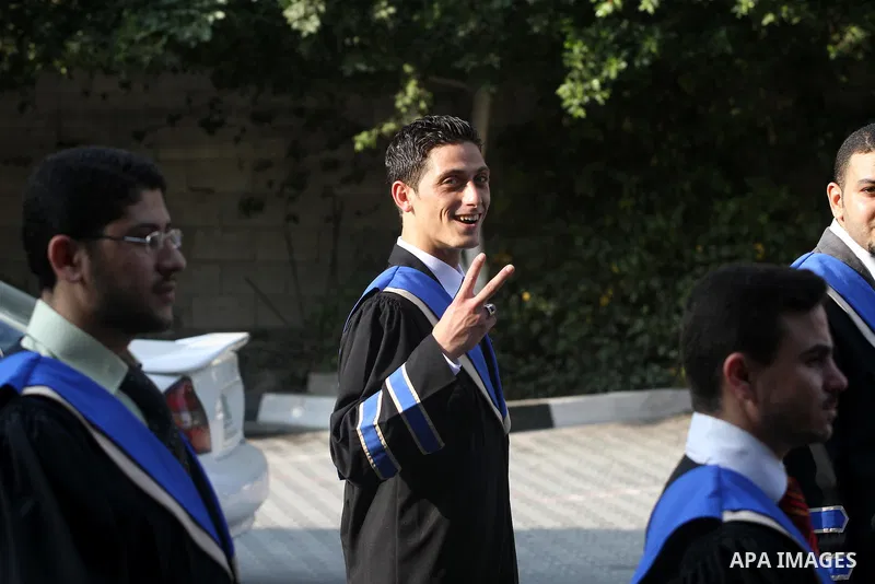 Palestinian students participate in their graduation ceremony at the Islamic University in Gaza city on July 12, 2011. Photo by Mohammed Asad