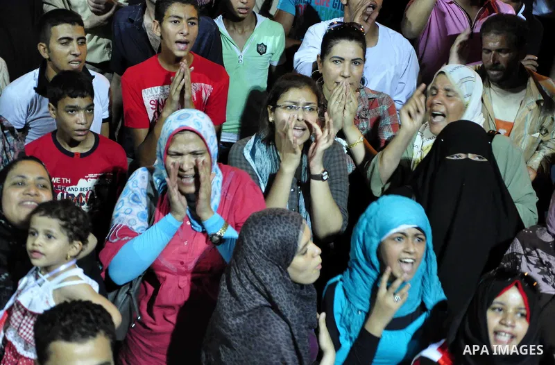 Egyptians are gathered at one of the Tharir square entrances where a sit-in is taking place, Cairo, Egypt, 12 July 2011. Egypt's military rulers on 12 July warned protesters against "harming public interests" after they...