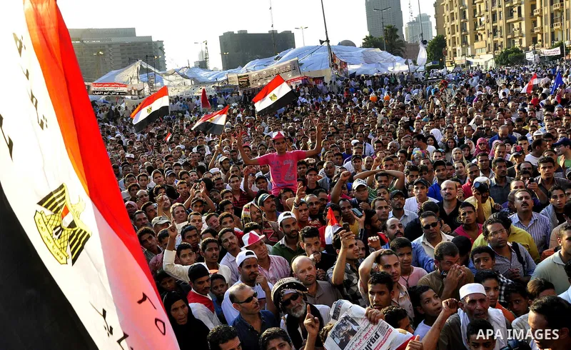 Egyptians are gathered at one of the Tharir square entrances where a sit-in is taking place, Cairo, Egypt, 12 July 2011. Egypt's military rulers on 12 July warned protesters against "harming public interests" after they...