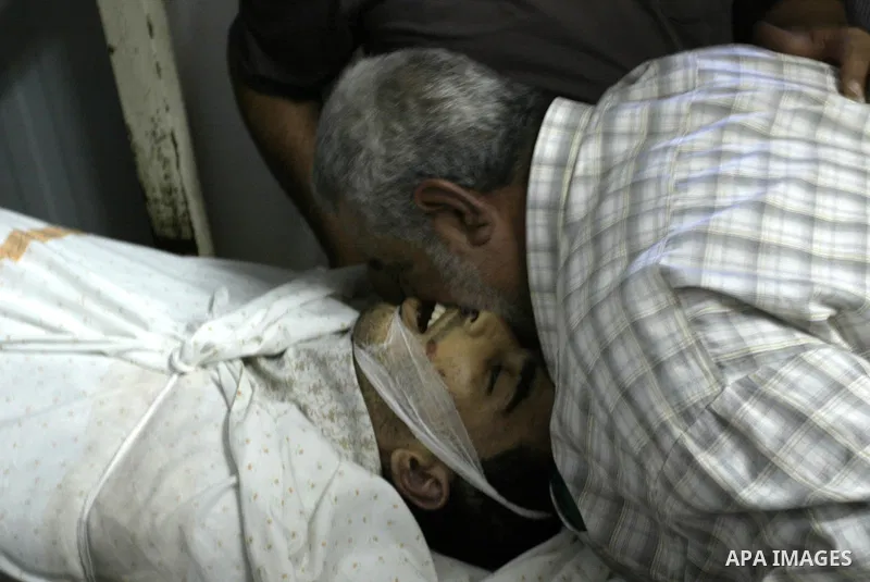 Palestinian Relatives identify the body of 21 year-old Ibrahim Sarhan, who was shot dead during an Israeli raid on the West Bank refugee camp Al-Fara, north of Nablus on July 13, 2011. Photo by Wagdi Eshtayah