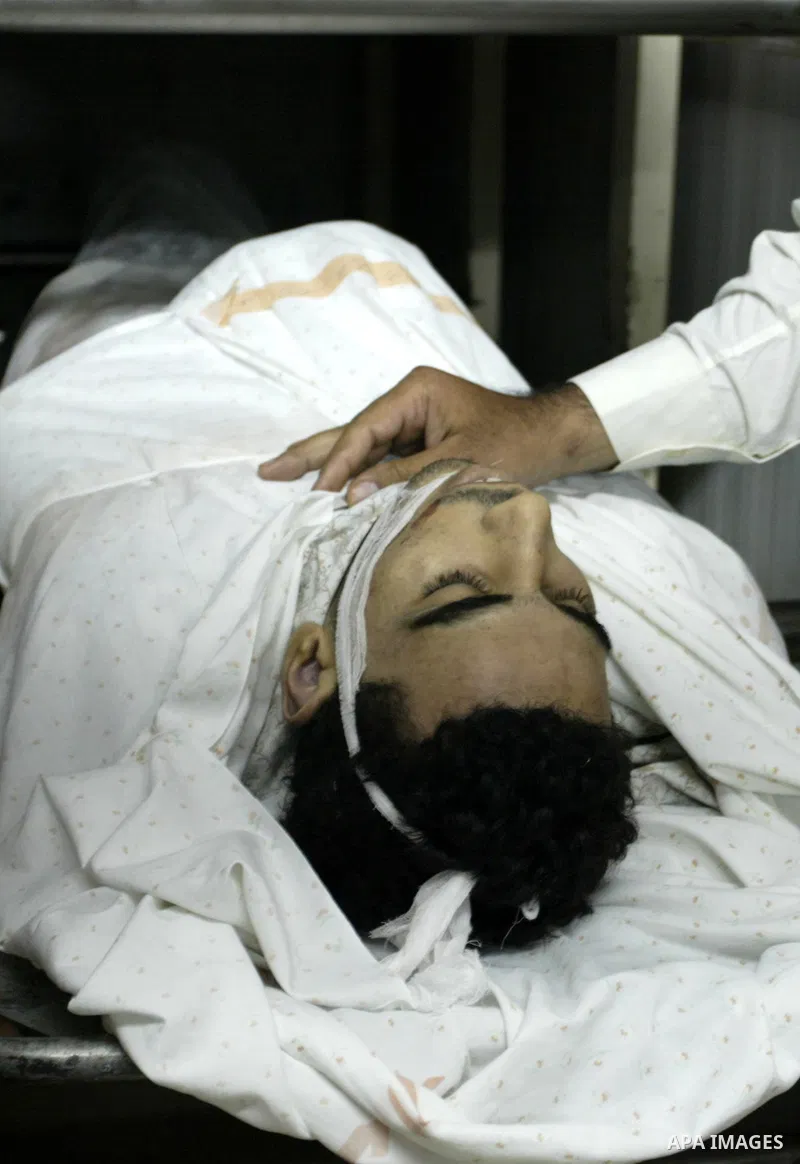 The body of Palestinian Ibrahim Sarhan, killed by Israeli military, in the morgue in the Rafidiya Hospital in the West Bank city of Nablus, Wednesday, July 13, 2011. Sarhan was killed Wednesday in an Israeli military rai...