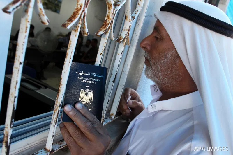 A Palestinian man waits to register his name with the Ministry of the Interior in the lists of travel in Gaza city on July 13, 2011. Where there are more than 20 thousand citizens need to travel abroad, The Egyptian side...