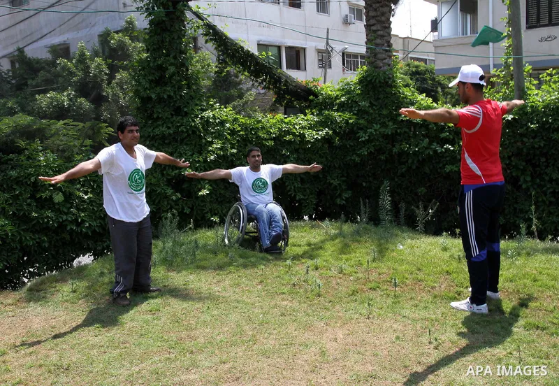 Palestinian members of the Olympic team for the disabled participate in training at Al-Gezira Club in Gaza city on July 13,2011. Palestinian Olympic team won Arab and international medals and have achieved excellent cent...