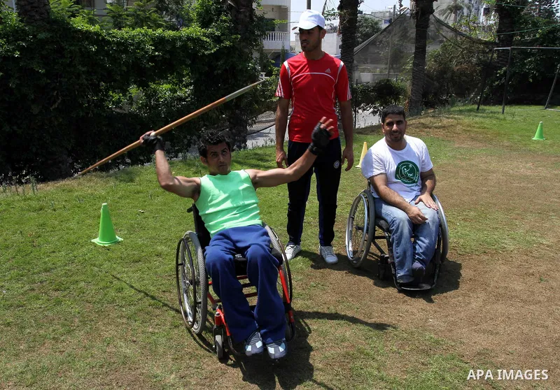 Palestinian members of the Olympic team for the disabled participate in training at Al-Gezira Club in Gaza city on July 13,2011. Palestinian Olympic team won Arab and international medals and have achieved excellent cent...