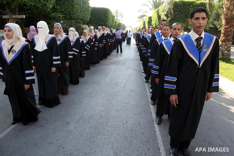 Palestinian students participate in their graduation ceremony at the Islamic University in Gaza city on July 13, 2011. Photo by Mohammed Asad