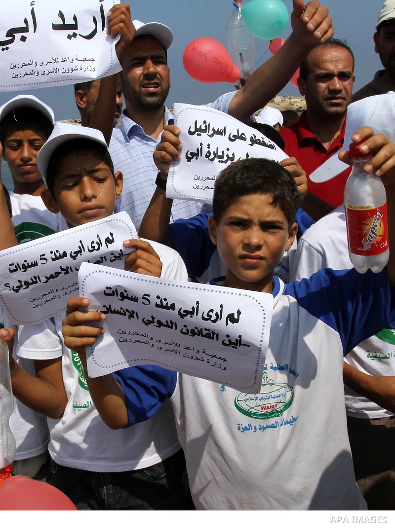 Children of Palestinian prisoners take part in a protest calling Israel to allow residents of Gaza to visit their relatives imprisoned in Israel, on July 14, 2011 in Gaza City. Israel stopped allowing Palestinians from t...