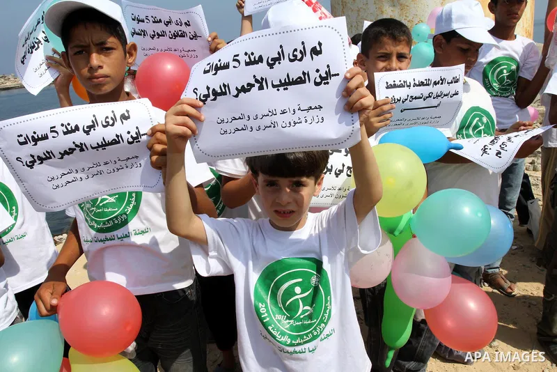 Children of Palestinian prisoners take part in a protest calling Israel to allow residents of Gaza to visit their relatives imprisoned in Israel, on July 14, 2011 in Gaza City. Israel stopped allowing Palestinians from t...