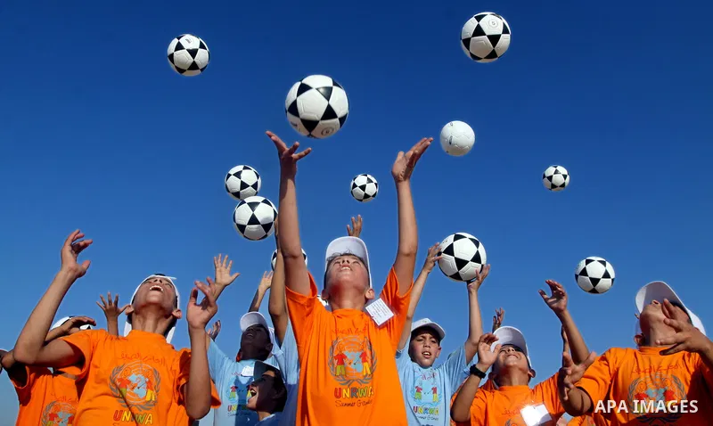 Palestinian children play with balls during summer camp activities supervised by the UN Relief and Works Agency (UNRWA) in Rafah in the southern Gaza Strip on July 14, 2011. Photo by Ali Jadallh