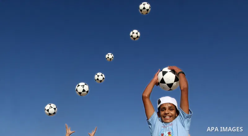 Palestinian children play with balls during summer camp activities supervised by the UN Relief and Works Agency (UNRWA) in Rafah in the southern Gaza Strip on July 14, 2011. Photo by Ali Jadallh