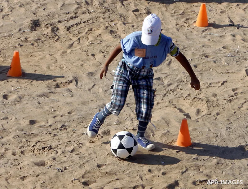 Palestinian children play with balls during summer camp activities supervised by the UN Relief and Works Agency (UNRWA) in Rafah in the southern Gaza Strip on July 14, 2011. Photo by Ali Jadallh