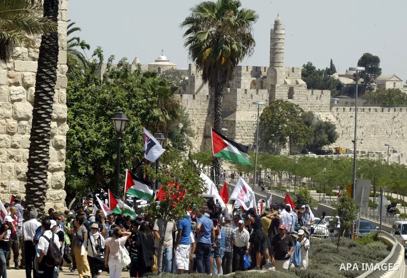 Israeli, Palestinian and foreign activists march calling for an independent Palestinian state on July 15, 2011. Some 1,000 Israelis and Palestinians gathered in east Jerusalem for a protest march to support the Palestini...