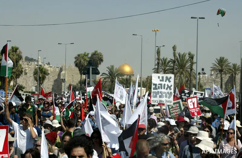 Israeli, Palestinian and foreign activists march calling for an independent Palestinian state on July 15, 2011. Some 1,000 Israelis and Palestinians gathered in east Jerusalem for a protest march to support the Palestini...