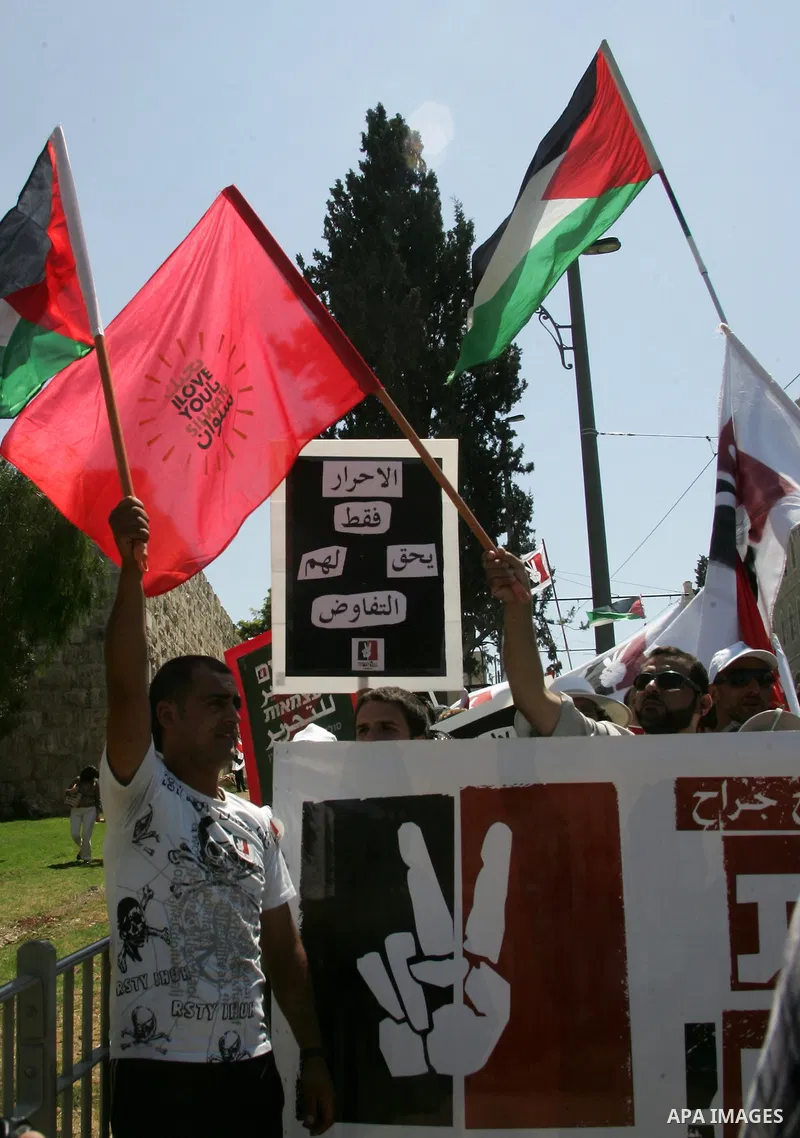 Israeli, Palestinian and foreign activists march calling for an independent Palestinian state on July 15, 2011. Some 1,000 Israelis and Palestinians gathered in east Jerusalem for a protest march to support the Palestini...