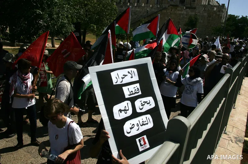 Israeli, Palestinian and foreign activists march calling for an independent Palestinian state on July 15, 2011. Some 1,000 Israelis and Palestinians gathered in east Jerusalem for a protest march to support the Palestini...