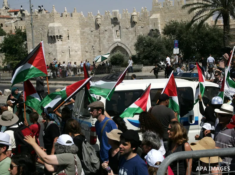 Israeli, Palestinian and foreign activists march calling for an independent Palestinian state on July 15, 2011. Some 1,000 Israelis and Palestinians gathered in east Jerusalem for a protest march to support the Palestini...