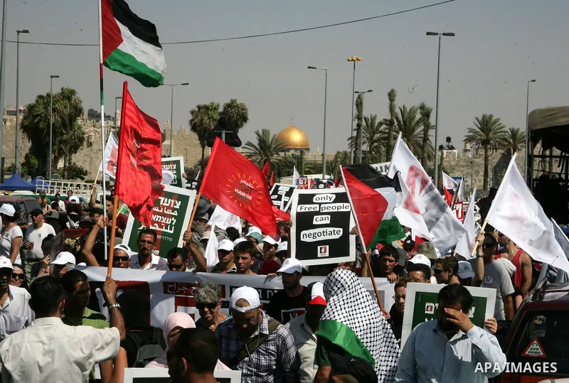 Israeli, Palestinian and foreign activists march calling for an independent Palestinian state on July 15, 2011. Some 1,000 Israelis and Palestinians gathered in east Jerusalem for a protest march to support the Palestini...