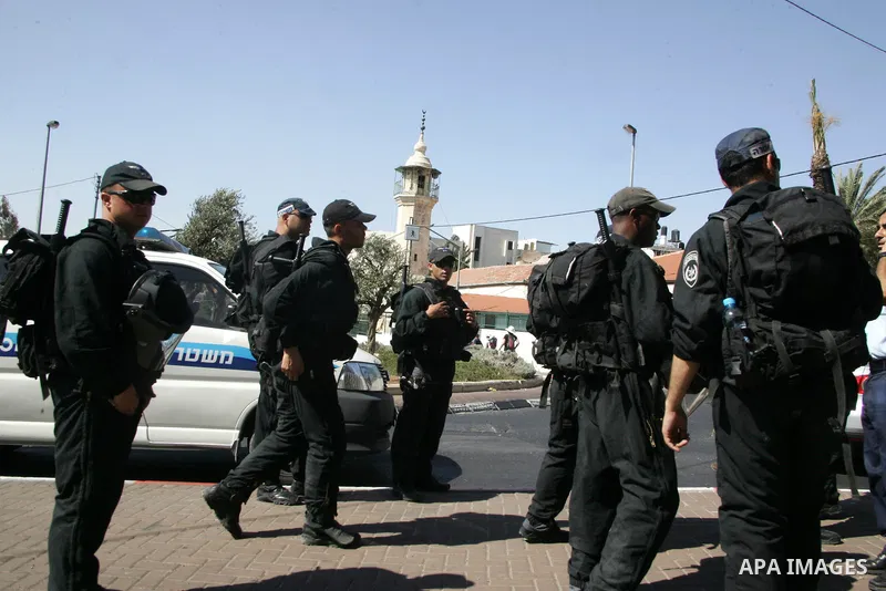 Israeli soldiers stand guards as Israeli, Palestinian and foreign activists march calling for an independent Palestinian state on July 15, 2011. Some 1,000 Israelis and Palestinians gathered in east Jerusalem for a prote...
