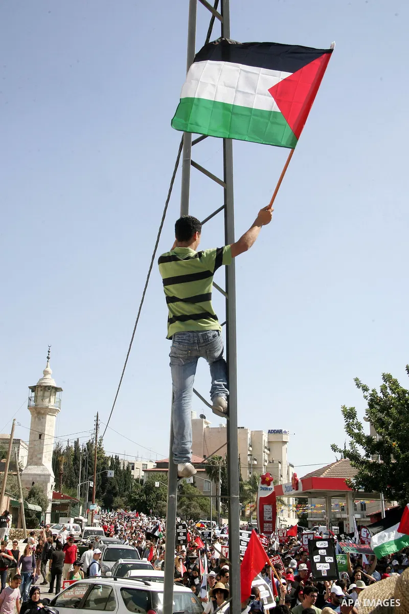 Israeli, Palestinian and foreign activists march calling for an independent Palestinian state on July 15, 2011. Some 1,000 Israelis and Palestinians gathered in east Jerusalem for a protest march to support the Palestini...