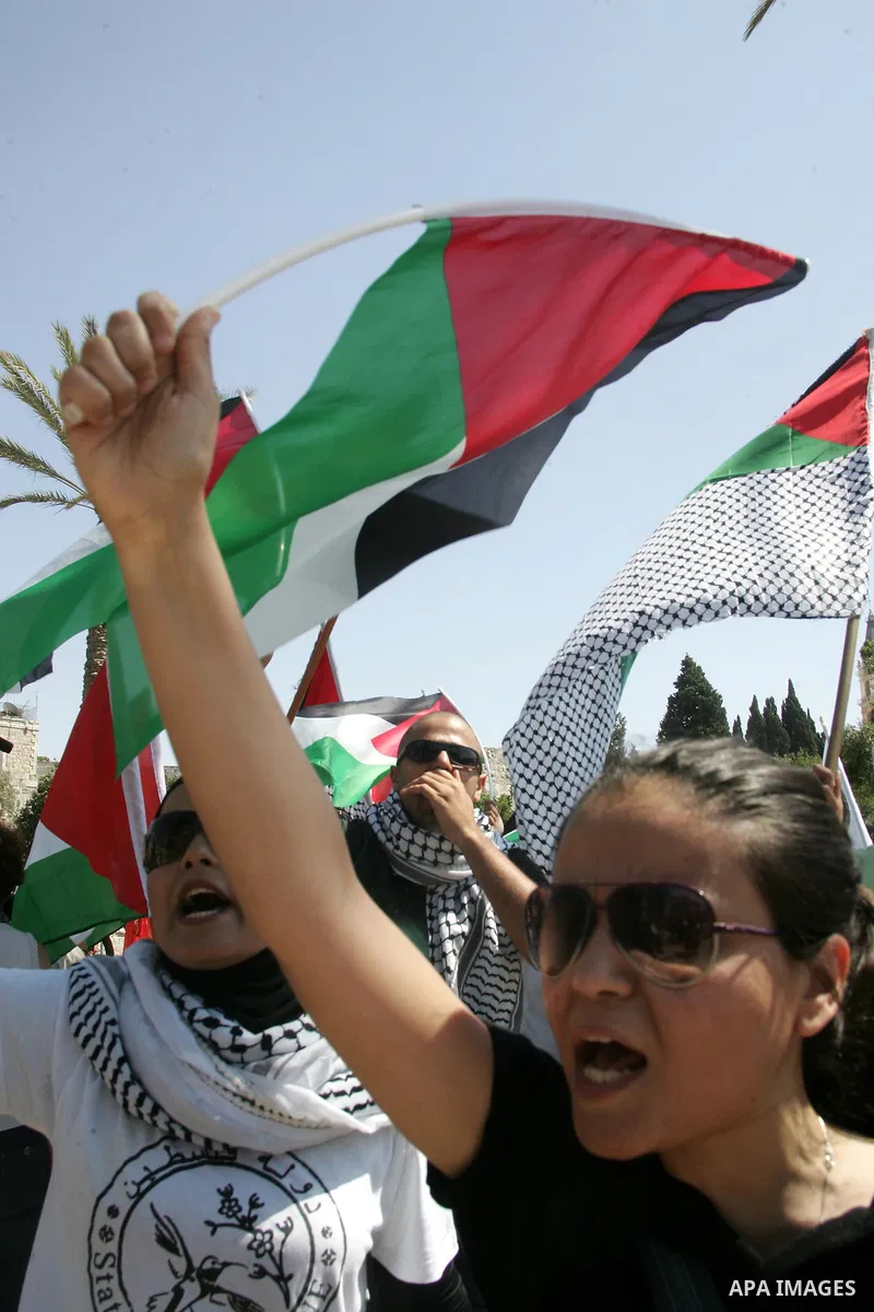 Israeli, Palestinian and foreign activists march calling for an independent Palestinian state on July 15, 2011. Some 1,000 Israelis and Palestinians gathered in east Jerusalem for a protest march to support the Palestini...