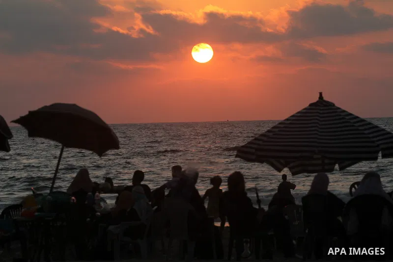 Palestinians enjoy their times in the sea on Gaza's beach on on July 15, 2011. Reports state that during the summer the beach is a major venue for entertainment and leisure in the Gaza. Photo by Mohammed Asad