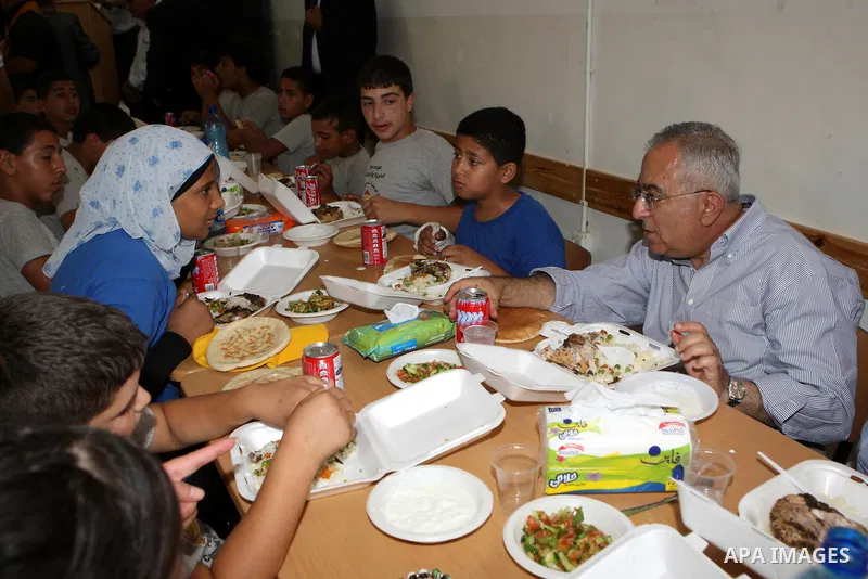 Palestinian Prime Minister, Salam Fayyad visits the summer camp "Palestine in the eyes of martyrs' sons" in al-Fara'a refugee camp in the West Bank on July 16, 2011. Photo by Mustafa Abu Dayeh