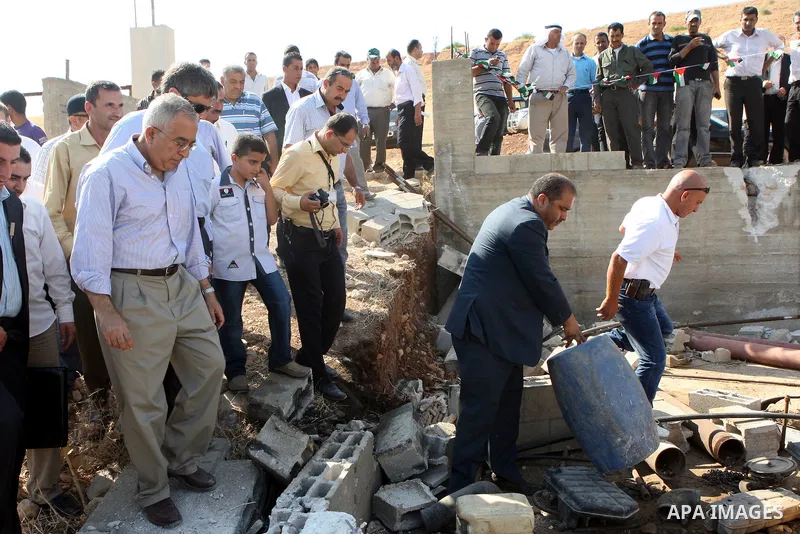 Palestinian Prime Minister, Salam Fayyad visits the water wells which were destroyed by Israeli army in al-Nassaria, near the West Bank town of Tubas on July 16, 2011. Photo by Mustafa Abu Dayeh