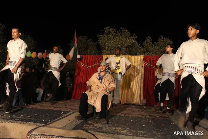 Palestinian youths dance the traditional dabka around the groom during his ceremony in Gaza city on July 16, 2011. Photo by Mohammed Asad