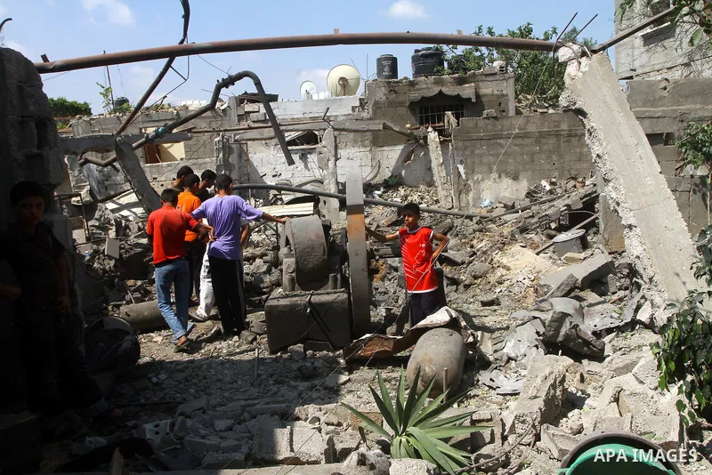 Palestinians inspect damages in Beit Hanun in the northern Gaza Strip on July 17, 2011 as seven people were wounded by what Palestinian medical sources said was an Israeli air strike, but Israel denied it had carried out...