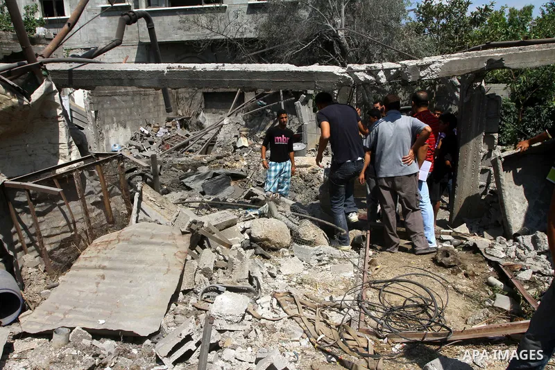 Palestinians inspect damages in Beit Hanun in the northern Gaza Strip on July 17, 2011 as seven people were wounded by what Palestinian medical sources said was an Israeli air strike, but Israel denied it had carried out...