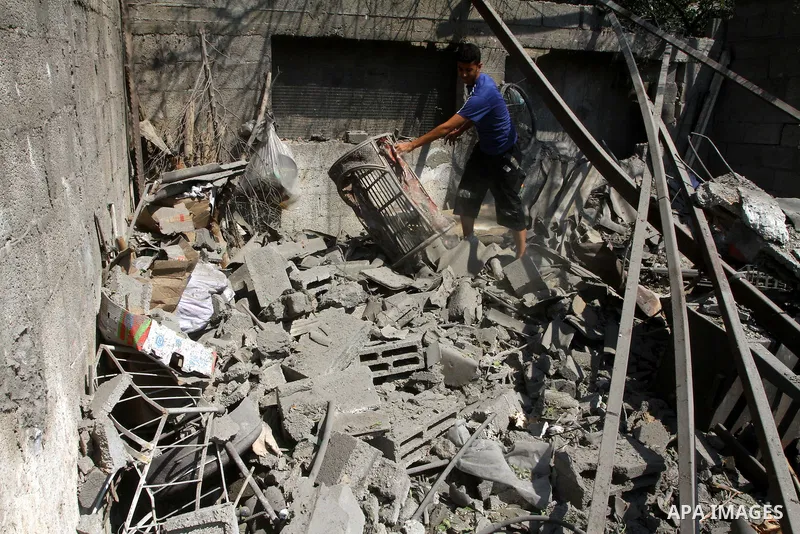 A Palestinian man inspects damages in Beit Hanun in the northern Gaza Strip on July 17, 2011 as seven people were wounded by what Palestinian medical sources said was an Israeli air strike, but Israel denied it had carri...