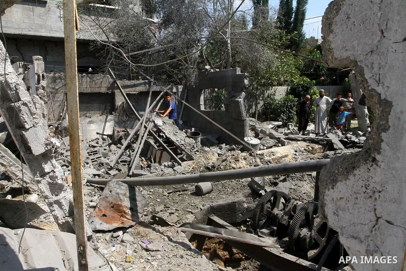 A Palestinian man inspects damages in Beit Hanun in the northern Gaza Strip on July 17, 2011 as seven people were wounded by what Palestinian medical sources said was an Israeli air strike, but Israel denied it had carri...