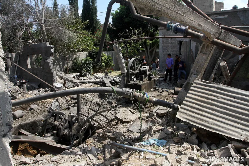 Palestinians inspect damages in Beit Hanun in the northern Gaza Strip on July 17, 2011 as seven people were wounded by what Palestinian medical sources said was an Israeli air strike, but Israel denied it had carried out...