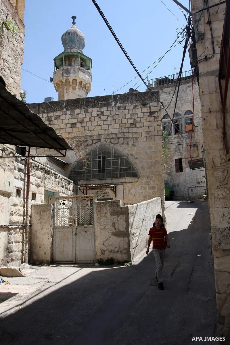 A Palestinian boy walks in the Old City of Nablus in the West Bank on July 18, 2011. Photo by Wagdi Eshtayah
