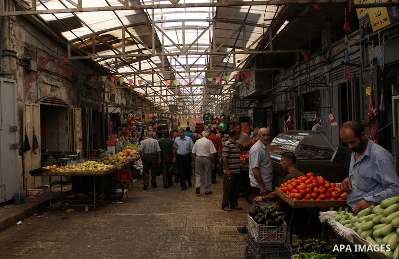 Palestinians buy vegetables in the market of the Old City of Nablus in the West Bank on July 18, 2011. Photo by Wagdi Eshtayah