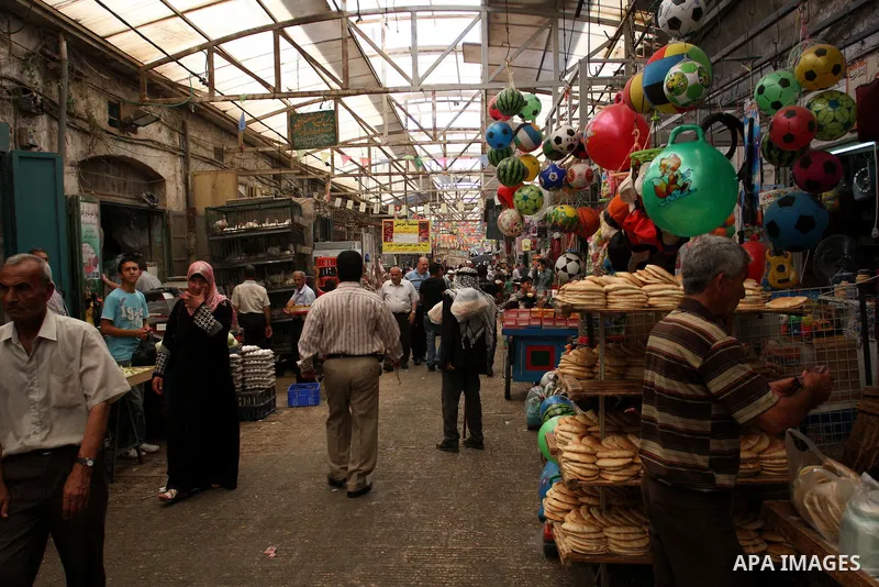 Palestinians buy vegetables in the market of the Old City of Nablus in the West Bank on July 18, 2011. Photo by Wagdi Eshtayah
